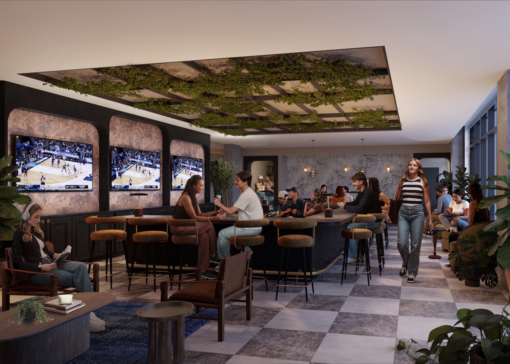 A stylish lounge bar for Purdue off campus housing residents, with people socializing, sitting at tables and the bar, watching basketball games on three large TVs. The ceiling features greenery, and the space is decorated with plants and modern furniture.