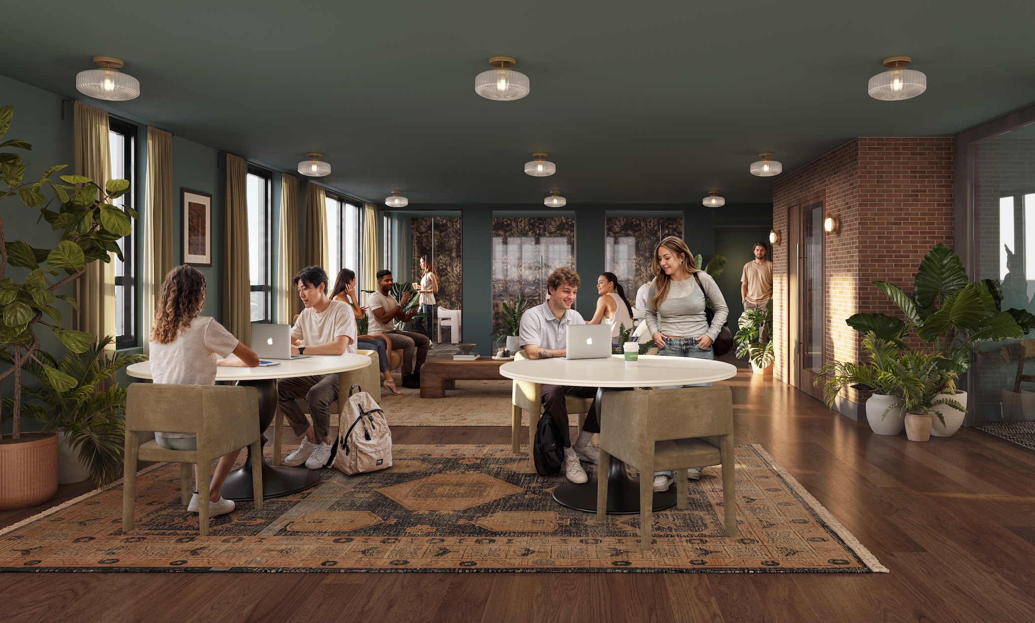 A modern lounge in Purdue off campus housing with large windows, green walls, wooden floors, and plants. People sit at round tables working on laptops, talking, and relaxing while others chat, creating a lively, collaborative atmosphere.