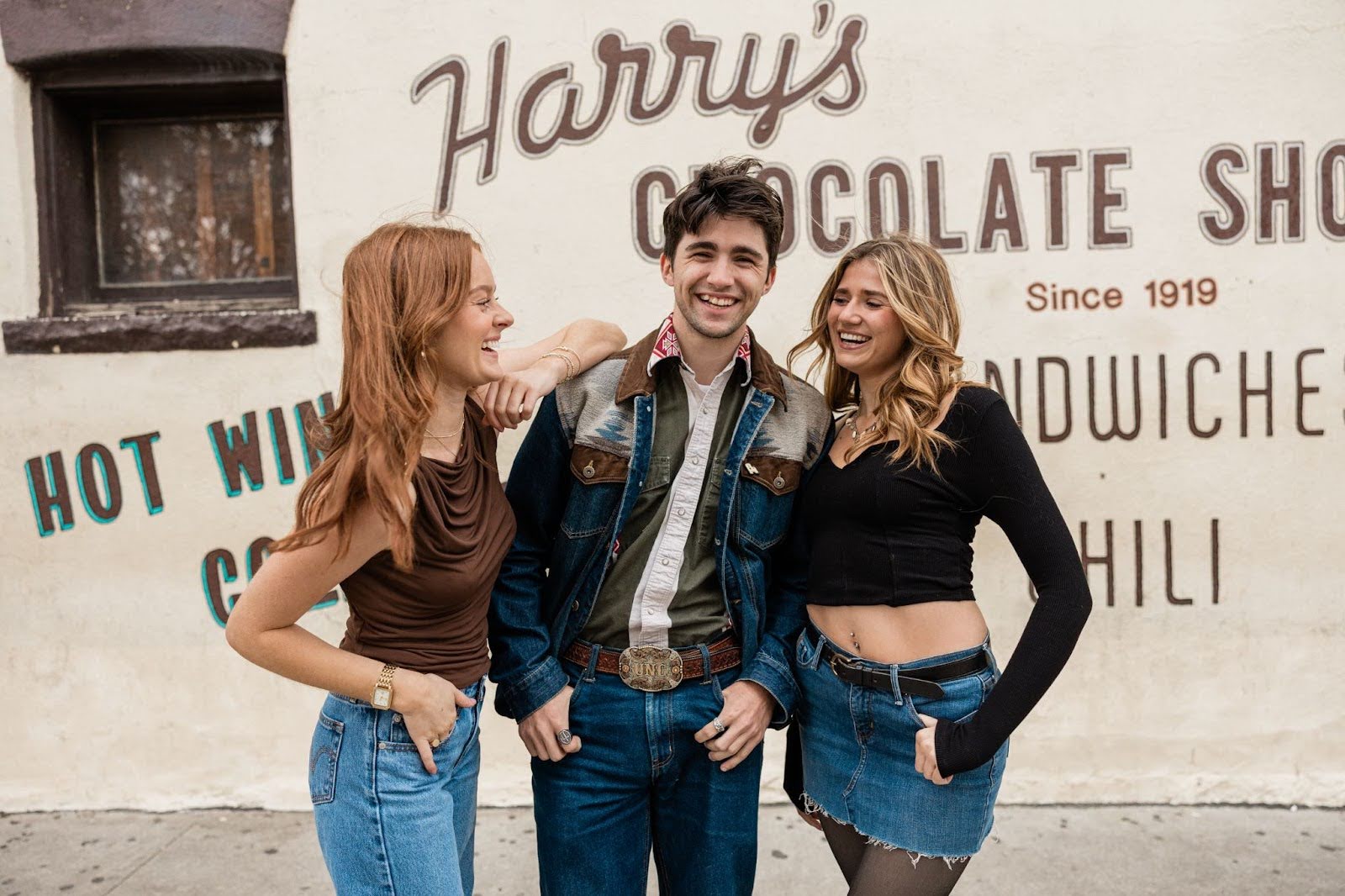 Purdue students hang out outside of Harry’s Chocolate Shop.
