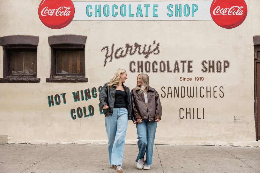Two students talking together outside of Harry’s near Purdue University’s campus.  