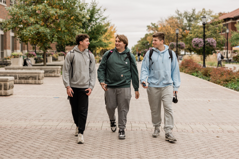 Three Purdue students walking together on campus.