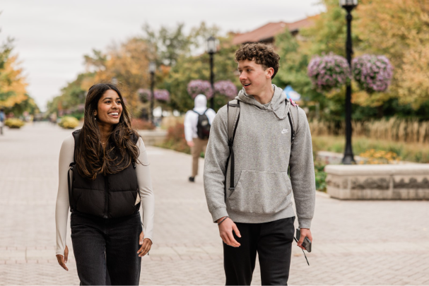 Two Purdue students walking on campus together.