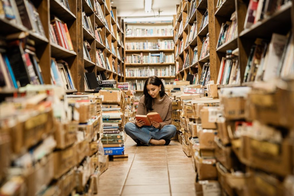 A Purdue student reads in a library on-campus in West Lafayette.