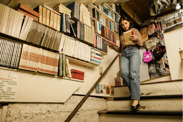 Purdue student shopping at a bookstore near Rambler Riverfront.