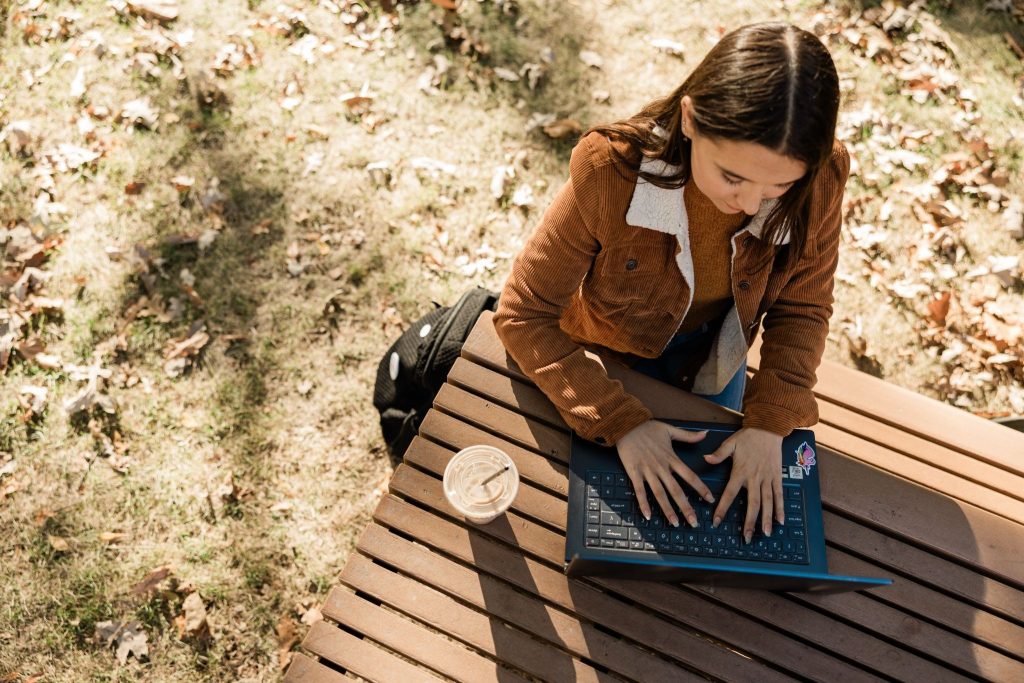 Girl working on her laptop on campus at Purdue University.