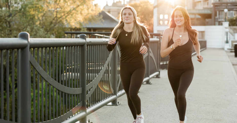 Two Purdue students jog on campus in West Lafayette. 