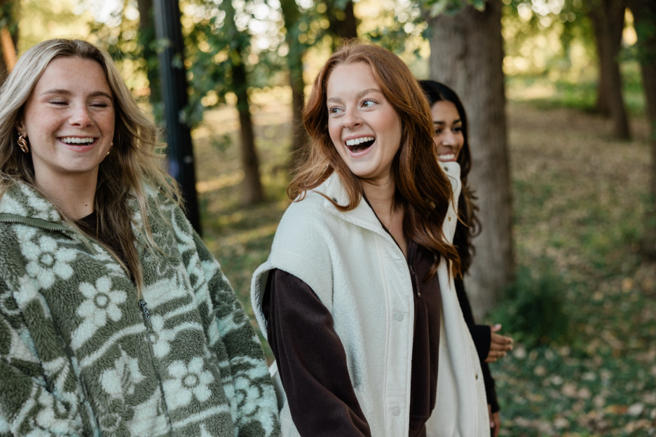 Purdue students laugh together on a walk around campus in West Lafayette. 